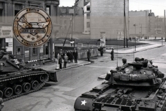 Soldiers from the U.S. Army Berlin Command face off against police from the former East Germany during one of several standoffs at Checkpoint Charlie in 1961. On several occasions that year, a U.S. quick reaction force of tanks and infantry Soldiers stood watch as armed military policemen escorted U.S. personnel across the border into East Berlin. (U.S. Army photo)